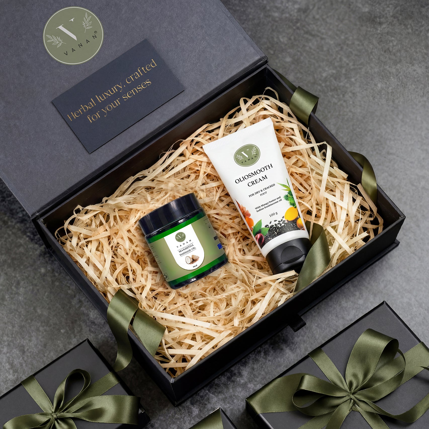 Gift set with jar and tube in a decorative box on a gray background