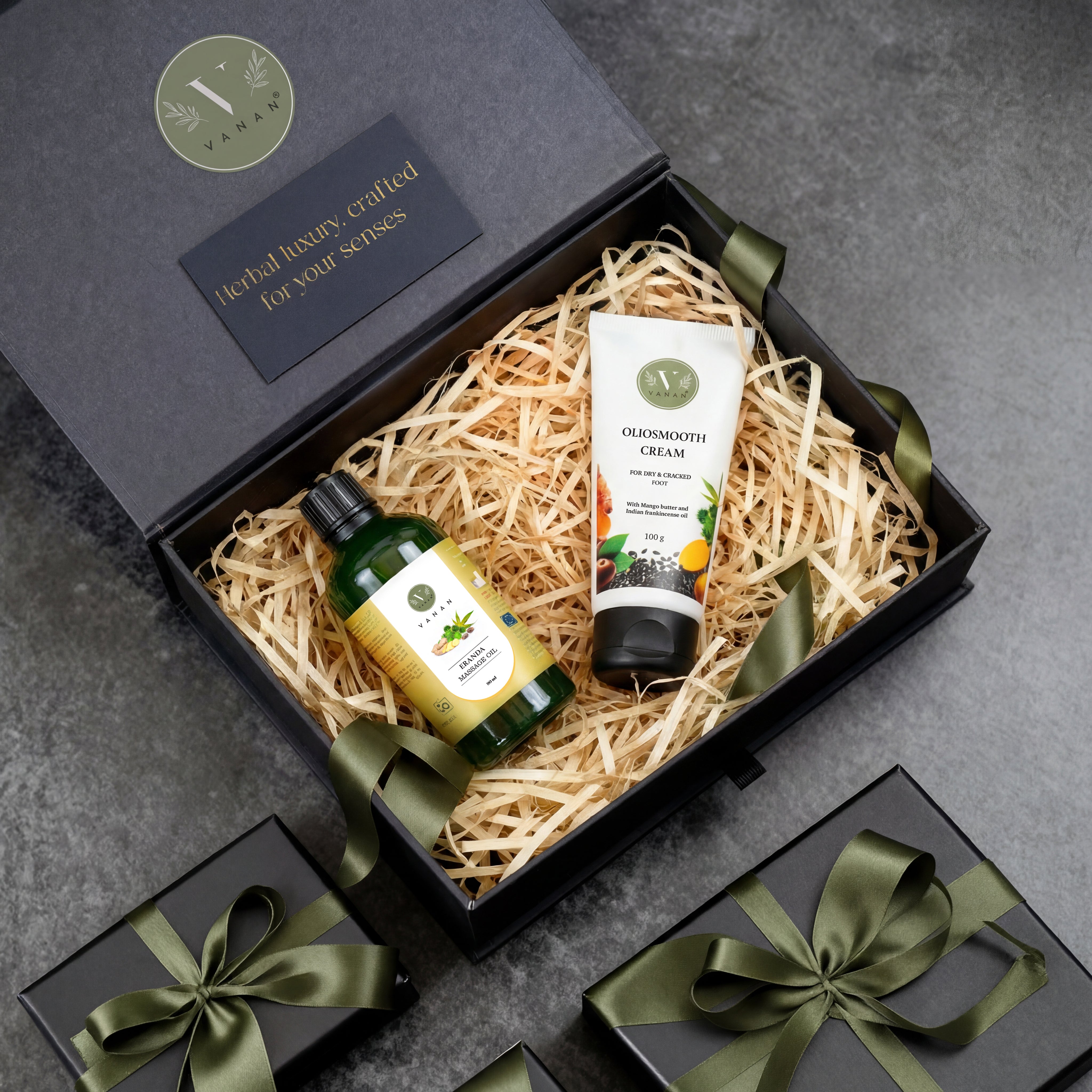 Gift set with skincare products in a black box on a gray surface