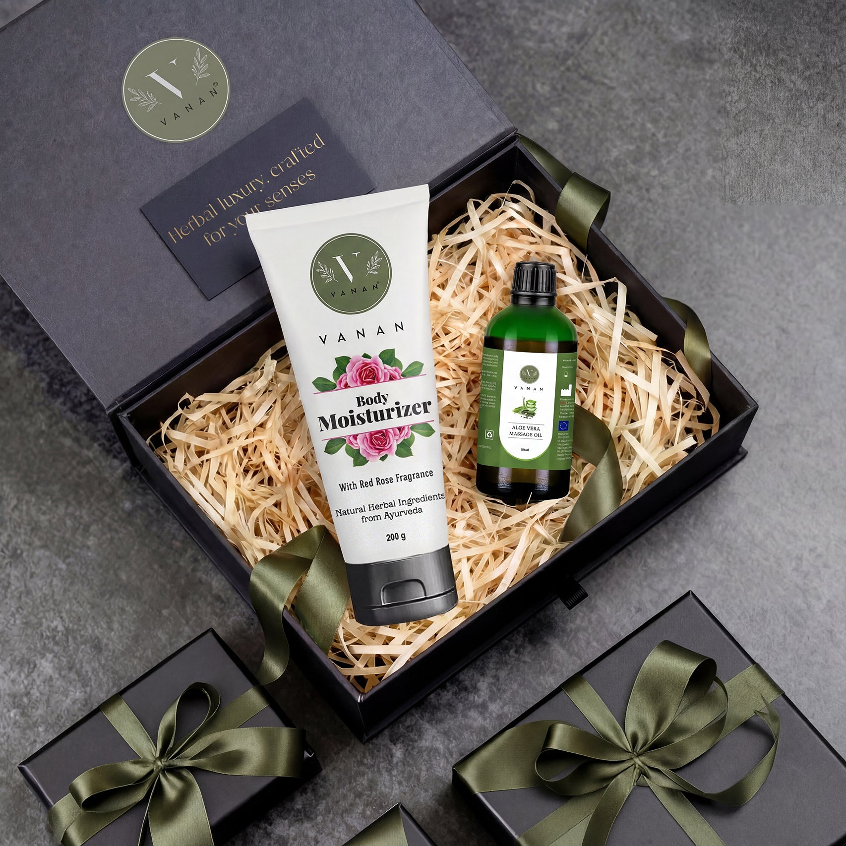 Gift set with Vanan body moisturizer and oil in a decorative box on a gray surface