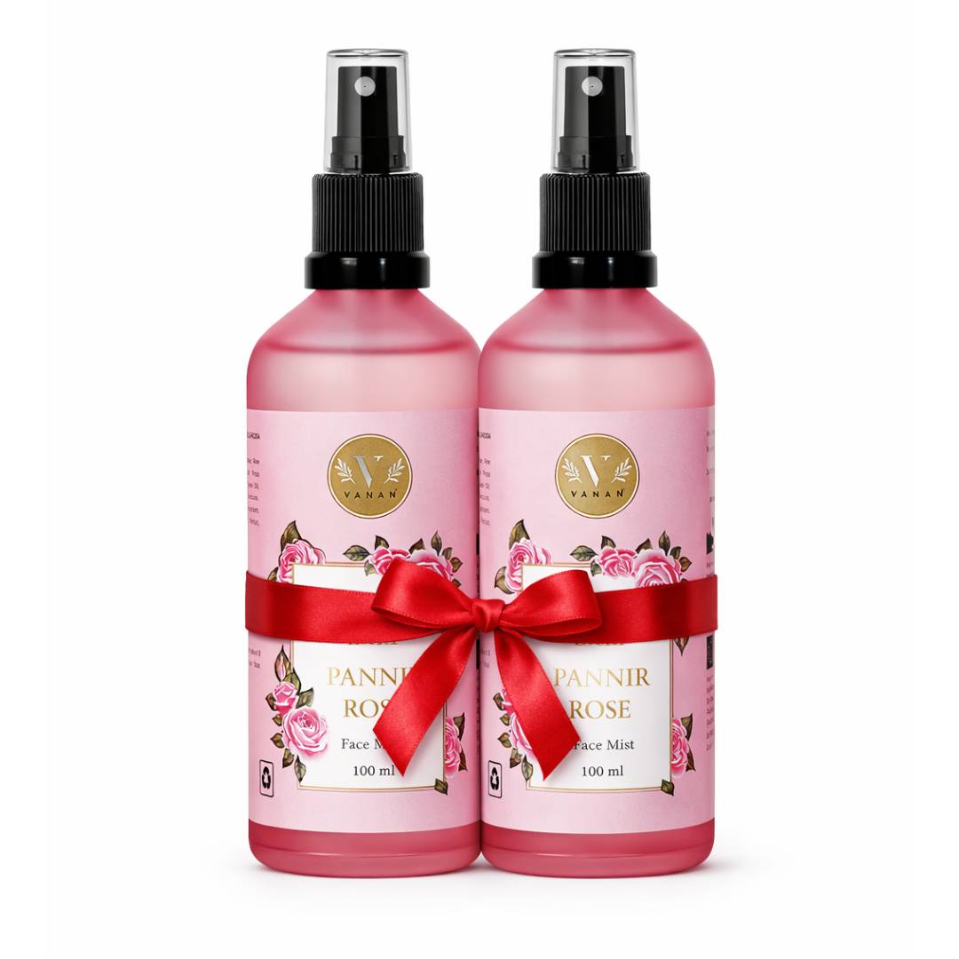 Two pink bottles with black sprayers and red ribbons on a white background